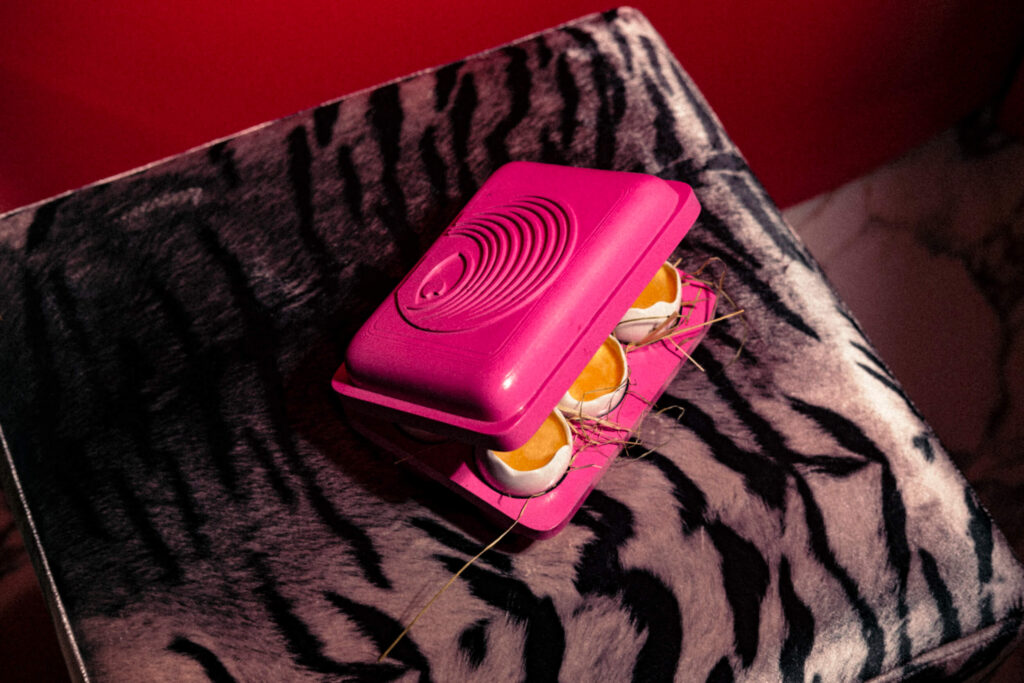 Table at Kuch Kuch cocktail bar in Malta with signature plates, small bites, and drinks in a speakeasy-style setting in St Julian’s.