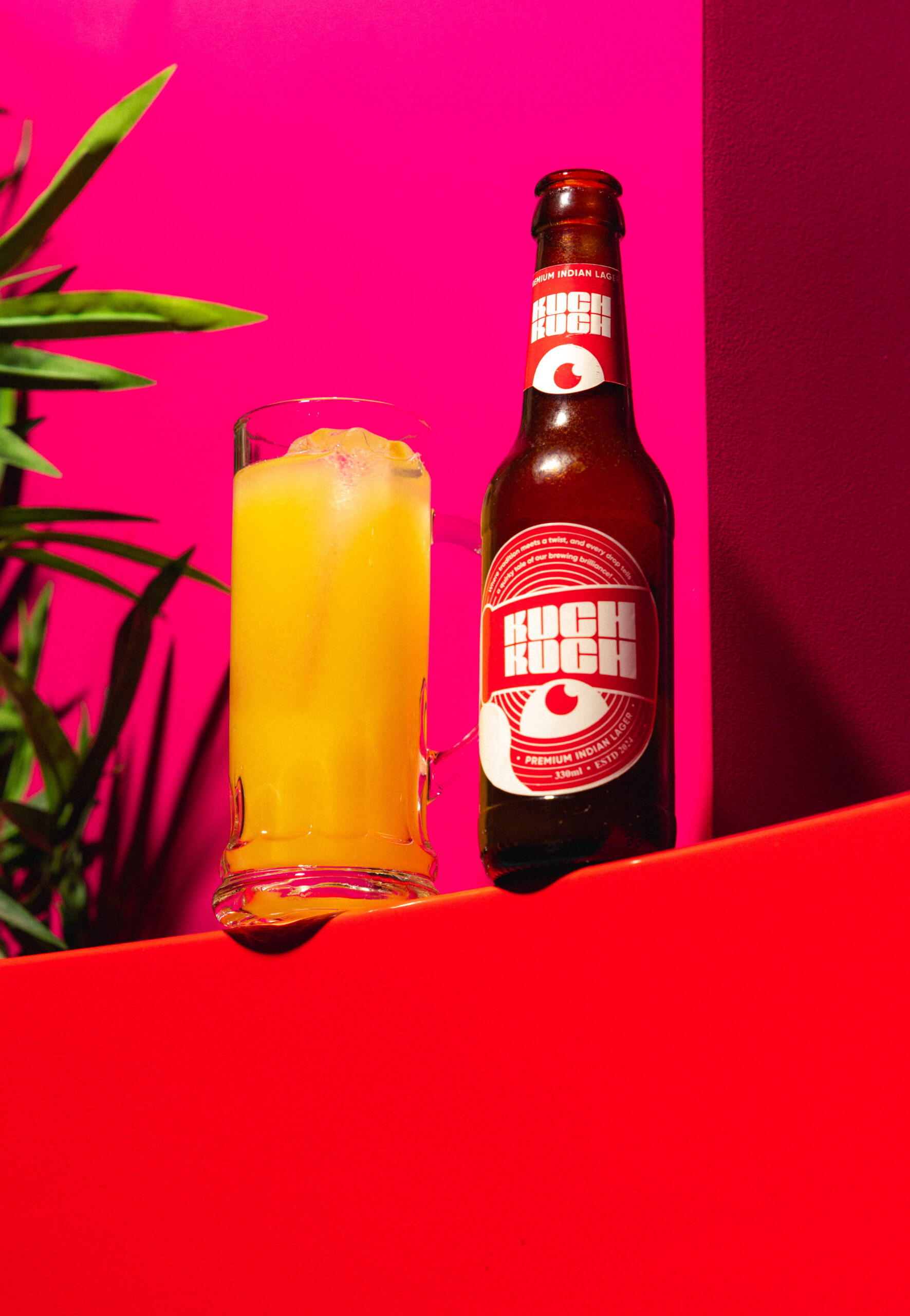 Kuch Kuch beer-style cocktail served in a branded beer bottle with a foamy, fizzy beer-like appearance at a cocktail bar in St Julian’s, Malta.