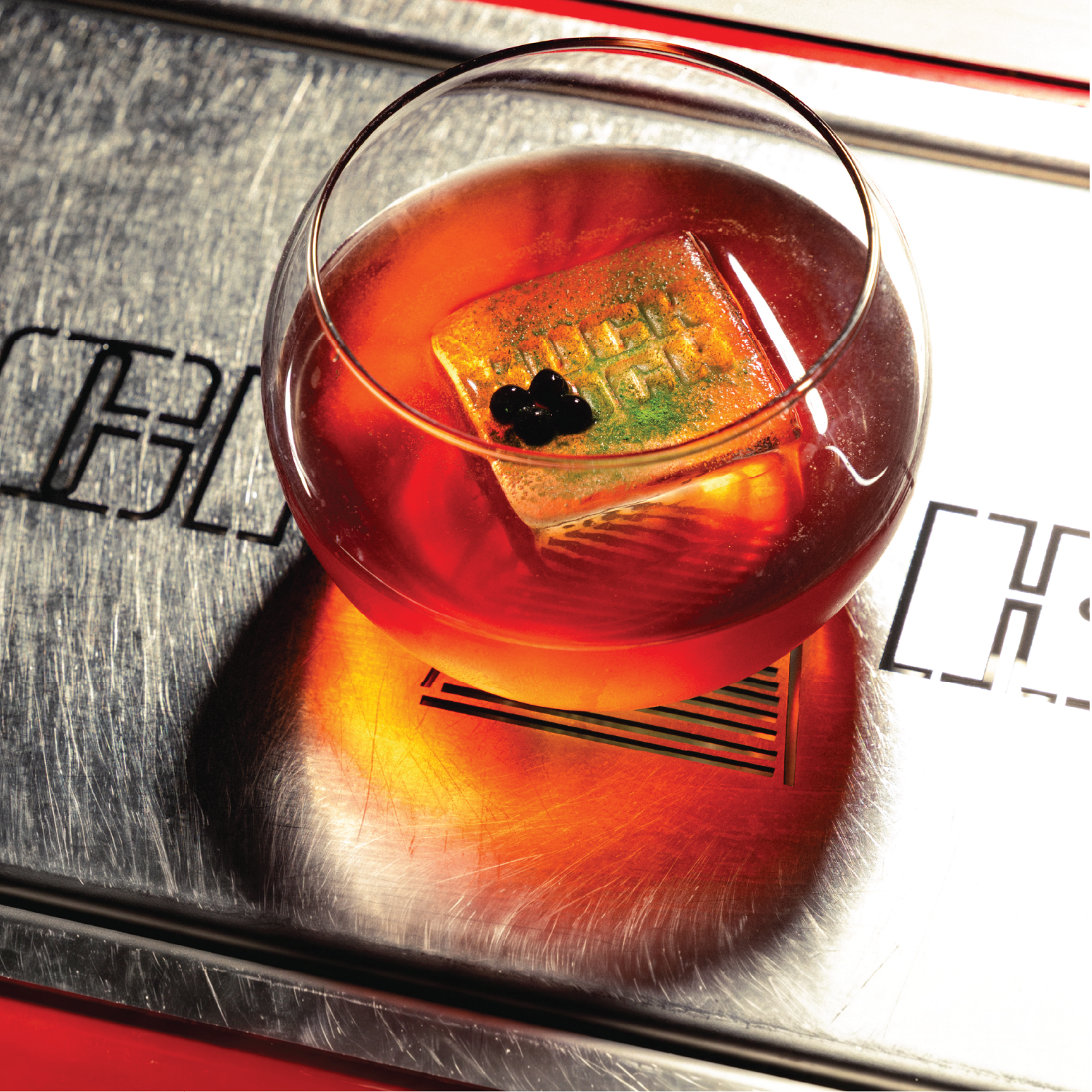 Her Name Was Vermouth, a Kuch Kuch signature Negroni cocktail with branded ice, served at a creative cocktail bar in St Julian’s, Malta.